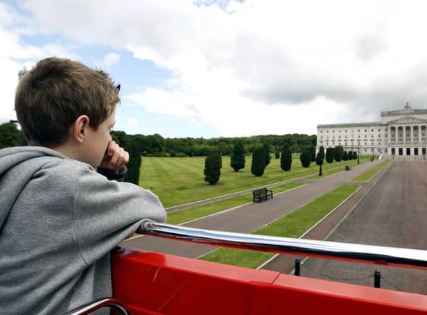 Eight year-old Joule Dallas from Co Tyrone looking at Stormont Building onboard the Belfast City Sightseeing Open Top Bus Tours in 2009. Picture: Diane Magill/News Letter archives