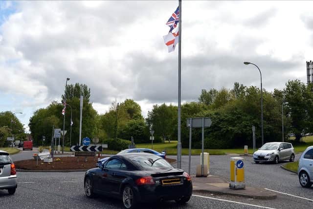 Union flags at the roundabout at the entrance to Craigavon Hospital.