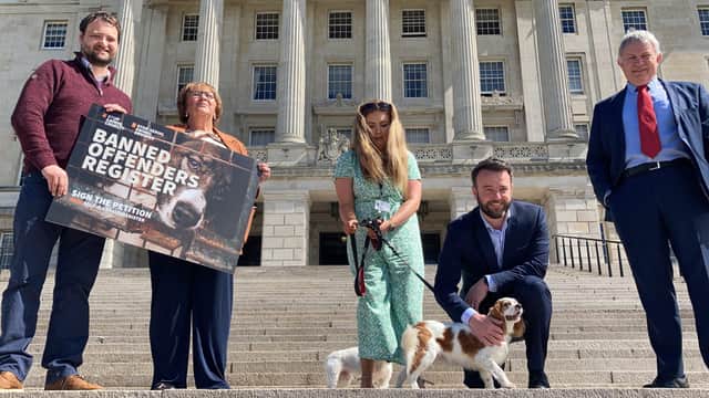 SDLP MLA Dolores Kelly (second from left), SDLP leader Colum Eastwood and SDLP MLA Patsy McGlone meet rescue dogs Lucy and Henry at Stormont before tabling a petition calling for a central register to be held of those convicted of animal cruelty offences to make it harder for them to rehome animals in future. Picture date: Monday June 28, 2021.
