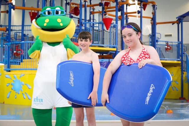 Eamon O’Mallon and Holly Holden ready to surf at Andersonstown Leisure Centre