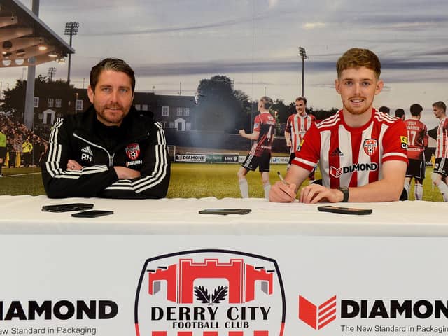 Derry City manager Ruaidhri Higgins and new signing Jamie McGonigle after the striker completed his move from Crusaders on a three and a half year deal. Photograph by George Sweeney.