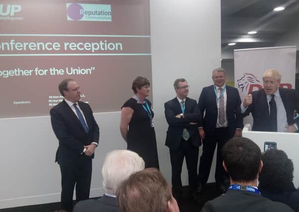 Nigel Dodds, Arlene Foster and Sir Jeffrey Donaldson listen to the prime minister, Boris Johnson, addressing the DUP drinks reception at the Conservative Party conference on Tuesday October 1 2019, the night before the DUP agreed to EU rules for Northern Ireland