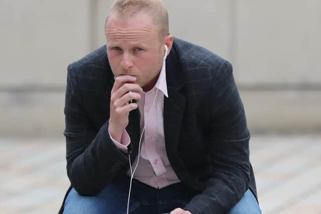 Loyalist activist Jamie Bryson pictured outside the High Court in Belfast earlier today. (Photo: PA)