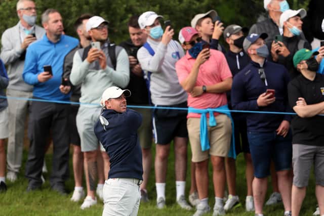 Rory McIlroy plays his second shot down the 12th watched by spectators during day two of the Dubai Duty Free Irish Open at Mount Juliet Estate. Pic by PA