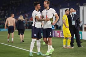 England's Jadon Sancho (left) congratulates team-mate Harry Kane after he is awarded the 'Man of the Match' award against Ukraine. Pic by PA.