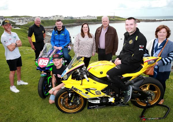 Armoy course clerk Bill Kennedy MBE (black polo shirt) with Vincent (centre) and Kathleen (far right) McAlonan and their daughter (Sean’s mum - centre) Briege Crawford. Also included in the photo are road racers (L to R), Davey Todd, Neil Kernohan, Joey Thompson and Darryl Tweed