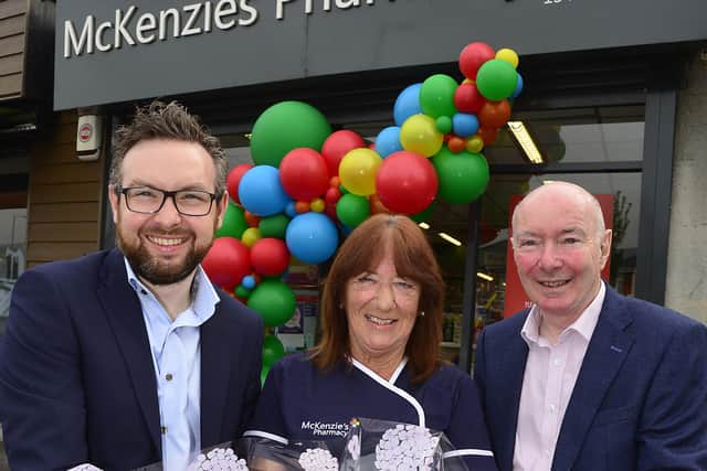Peter Rice, Isabel Keenan and Adrian Rice outside McKenzie’s Pharmacy