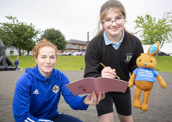 Nine-year-old Sarah Dickson with Northern Ireland International women's captain Marissa Callaghan
