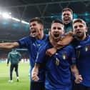 Jorginho (C) celebrates with teammates after scoring the winning penalty against Spain