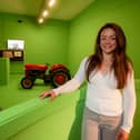 Clare Ablett, curator of history at National Museums NI with a display showcasing Harry Ferguson,  inventor of the revolutionary three-point linkage for tractors
