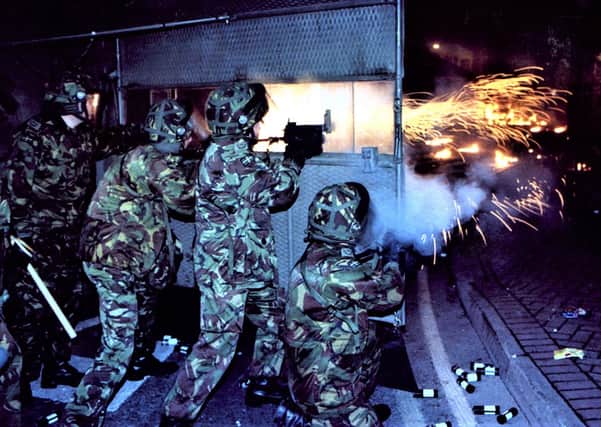 British soldiers fire plastic bullets during a riot in Londonderry, 1997