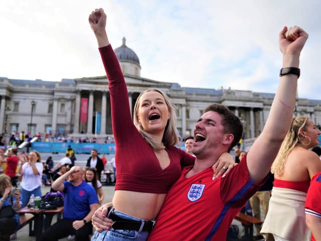 Fans in Trafalgar Square, London, celebrate Harry Kane's first goal as they watch the Euro 2020 quarter final match between England and the Ukraine. Picture date: Saturday July 3, 2021