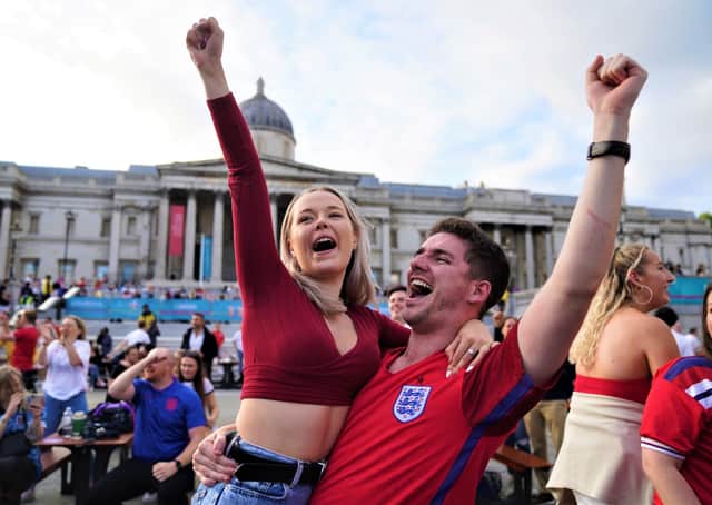 Fans in Trafalgar Square, London, celebrate Harry Kane's first goal as they watch the Euro 2020 quarter final match between England and the Ukraine. Picture date: Saturday July 3, 2021
