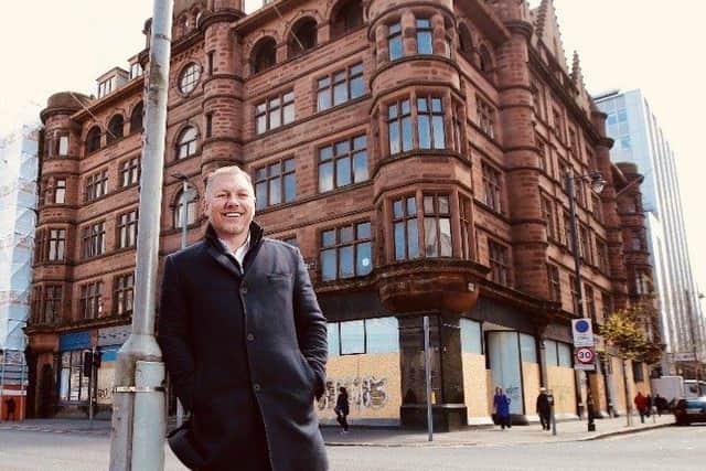 Signature Living’s owner and co-founder, Lawrence Kenwright outside the George Best Hotel