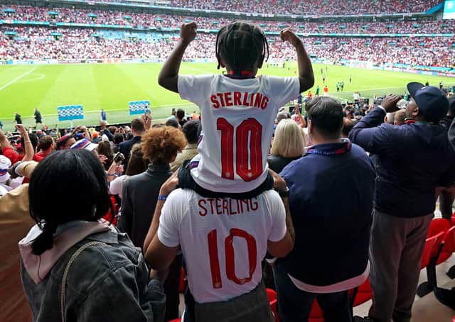 England's Raheem Sterling son Thiago celebrates with family after the final whistle during the UEFA Euro 2020 round of 16 match at Wembley Stadium, London on June 29. Pic: Mike Egerton/PA Wire.