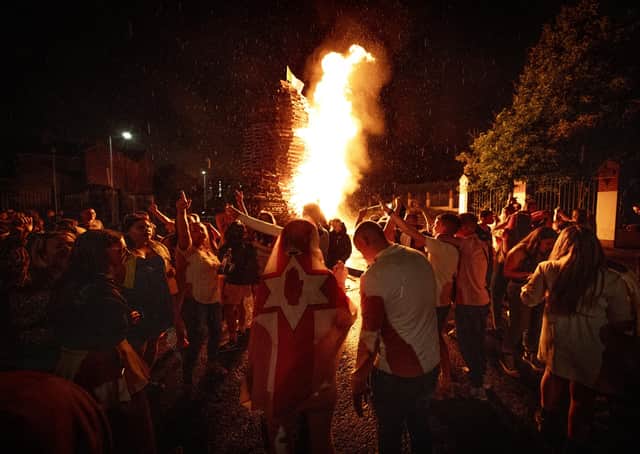 Tiger's Bay 'Eleventh Night' bonfire in Belfast alight in the early hours of Monday morning. Photo: Liam McBurney/PA Wire