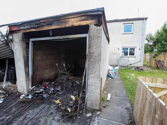 It is thought the fire took place in a garage at the property, with the four occupants of the adjoining house requiring assistance by the Northern Ireland Fire and Rescue Service. (Photo: Pacemaker)