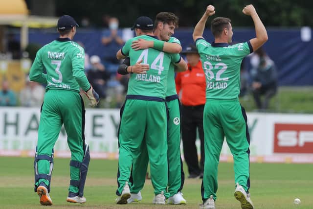 Ireland's Mark Adair (centre) celebrates taking the wicket of South Africa's Anrich Nortje during the second one day international