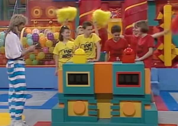 The 'wacky' Fun House set with enthused contestants and a dodgily clad Pat Sharp