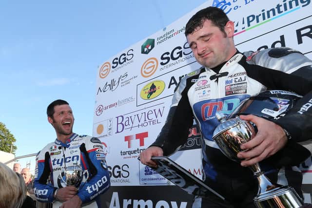 Guy Martin and Michael Dunlop share a joke at the Armoy Road Races in 2015.