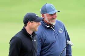 Rory McIlroy (left) alongside Darren Clarke during a practice round for the Open at Royal St George's. Pic by PA.