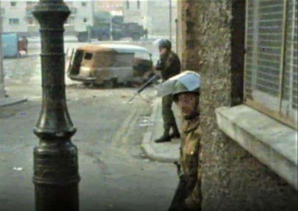 A soldier taking cover during Bloody Sunday