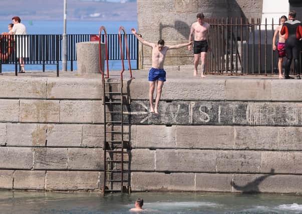 People having a splash at Donaghadee Harbour
