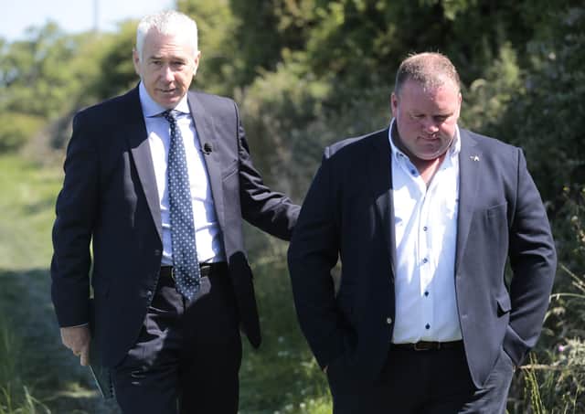 Jon Boutcher (left) walks with Eugene Oliver, as they make a fresh appeal for information relating to the murder of his father, Tom Oliver