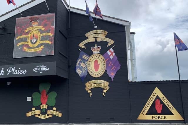 Alliance Party Cllr Peter Lavery said: "The signs, from the Mid-Ulster UVF and associated other paramilitaries, replaced facades of Edward Carson and the Somme among other historical events on the side of the Housing Executive property in Pollock Drive in Lurgan, close to a community centre."