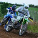 Jason Meara overall winner of the experts MX1 class and Richard Bird do battle in race two at Seaforde