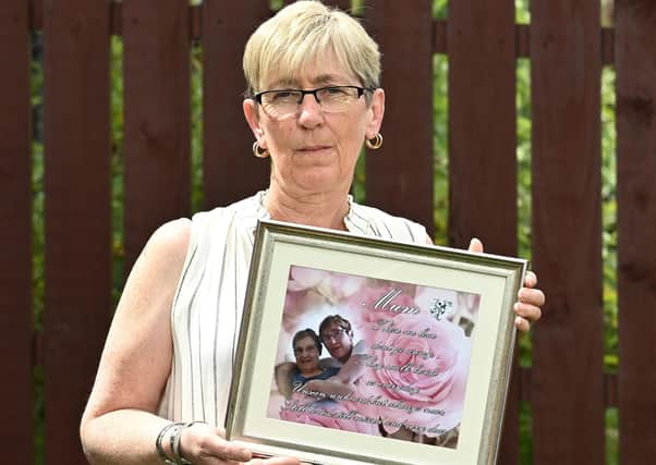 Carole Curlett with a picture of her late mother Ida.