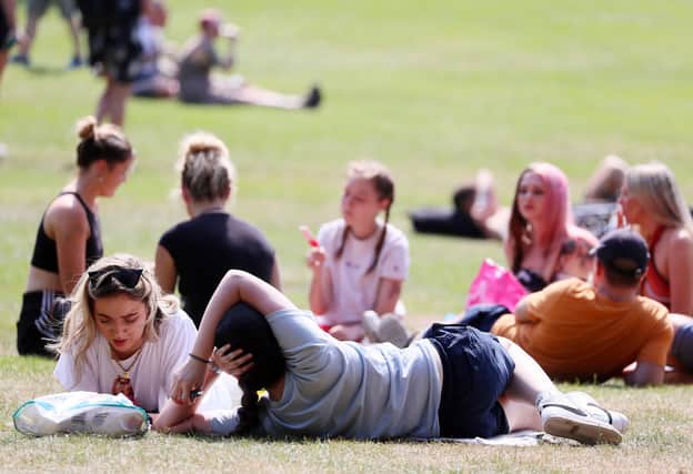 Northern Ireland continues to enjoy high temperatures as the warm weather continues. People in Botanic Gardens, Belfast