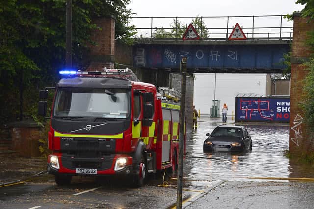 Motorists were advised that the Lisburn Road in Belfast was blocked, due to a car stuck in floodwater. 
Picture By: Arthur Allison/Pacemaker Press.