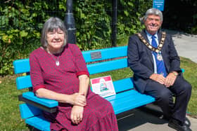 The Mayor of Antrim and Newtownabbey, Councillor Billy Webb, with Valerie Adams, chair of Antrim and Newtownabbey Loneliness Network, at the Chatty Bench at Antrim Castle Gardens.