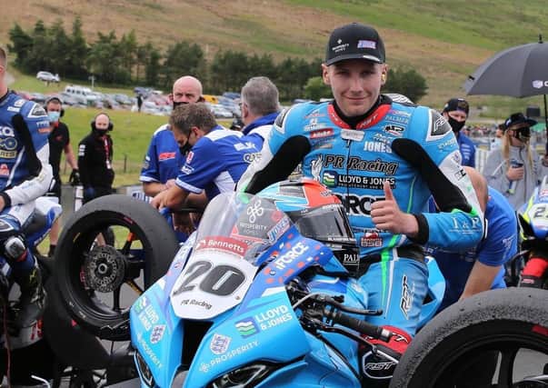 Dorset man Brad Jones remains in an induced coma in hospital following a crash at Brands Hatch.