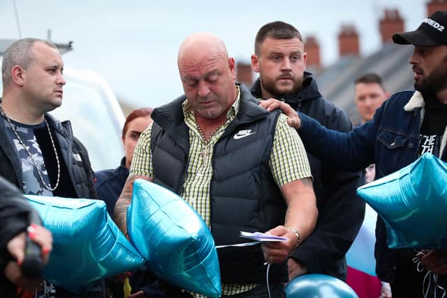 Liam O'Keefe, father of baby Liam, speaks to local residents as they take part in a vigil and balloon launch at Brompton Park, Ardoyne, North Belfast this evening in memory of his son. Photo by Kelvin Boyes  / Press Eye