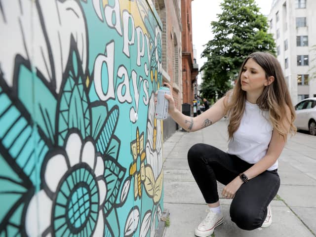 Artist Danni Simpson finishes of one of her artworks as part of phase 2 of Belfast City Council’s Belfast Canvas Project. Picture: Philip Magowan / Press Eye