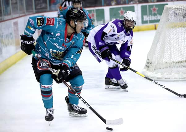 Belfast Giants' David Goodwin with Glasgow Clan's Liam Stenton during an Elite Ice Hockey League game at the SSE Arena, Belfast. Picture: William Cherry/Presseye