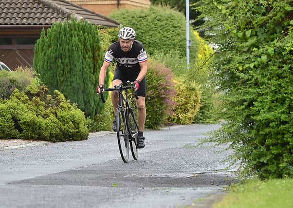 Nigel Quinn in the saddle near where he lives, south of Belfast, as he has been for 500 consecutive days.
Picture by Arthur Allison/Pacemaker Press