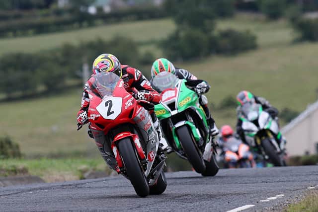 Davey Todd leads Derek McGee on his way to second place in the 'Race of Legends' at Armoy.
