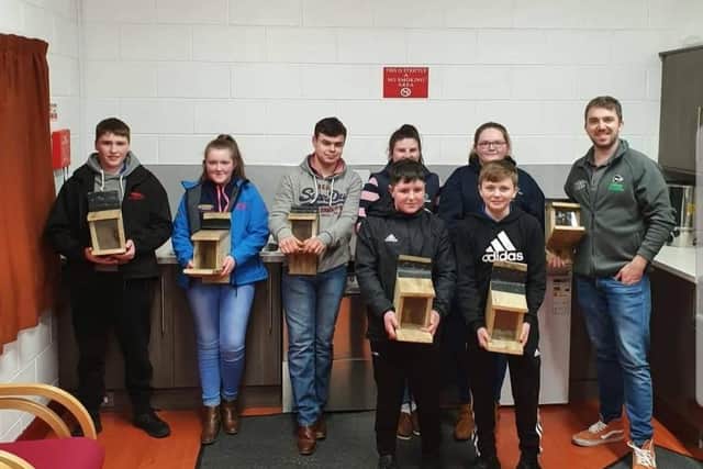 Mourne YFC eco committee members smiles all round after success building squirrels feeders that were later donated to the red squirrels United to help bring back the red squirrel population in the Mourne rural area