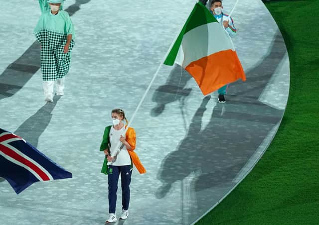 Ireland's Kellie Harrington with the tricolour flag during the closing ceremony of the Tokyo 2020 Olympic Games. Photo: Mike Egerton/PA Wire