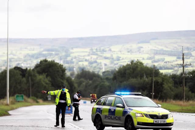 PSNI officers pictured at the scene of the collision on the Glenshane Road. (Photo: Presseye)
