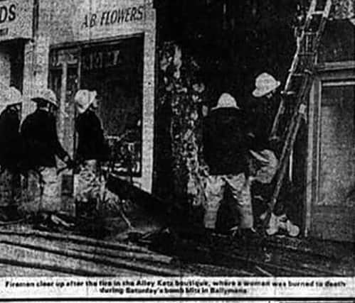 Yvonne Dunlop died in a fireball after discovering an IRA firebomb in her father's clothes shop, Alley Katz, in Ballymena. She only just had time to warn her nine-year-old son to escape before she died. Pictured is the aftermath of the bombing from the front page of the News Letter.