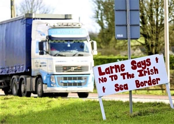 A lorry arrives at Larne port, where feelings in the town are running high against the NI Protocol