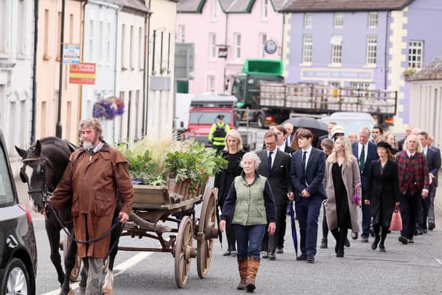 The Earl's coffin was taken through the village by horse and cart for the funeral service in the Church of the Immaculate Conception. Picture by Jonathan Porter/PressEye