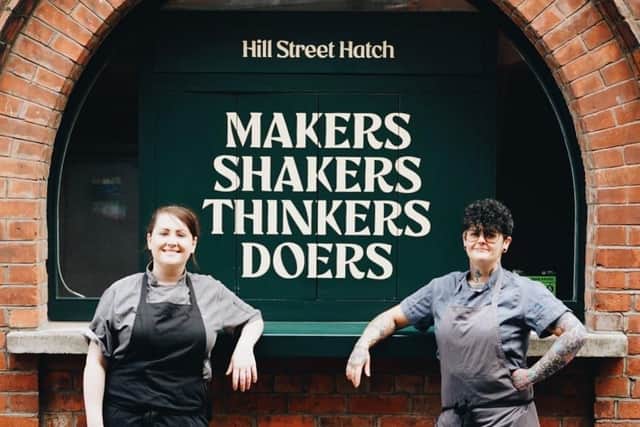 Gemma Austin, left, and Lauren Shimmins outside the novel Hill Street Hatch in Belfast’s busy Cathedral Quarter