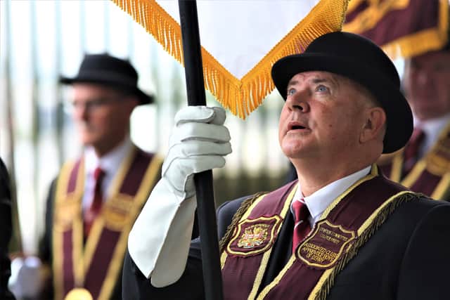 Press Eye - Belfast - Northern Ireland - 14th August 2021
Apprentice Boys of Derry ParadeApprentice Boys of Derry
Relief of Derry Parade.
A member of the Apprentice Boys of Derry checking his banner pole.
Mandatory Credit ©Lorcan Doherty/Presseye