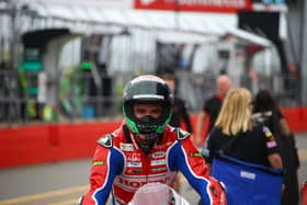 Honda Racing's Glenn Irwin crashed out of Sunday's opening British Superbike race at Donington Park after he was tagged from behind.