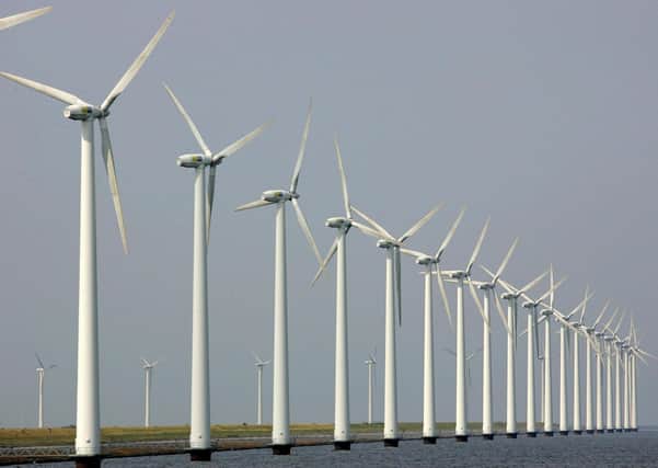 Wind turbines. (AP Photo/ Peter Dejong)